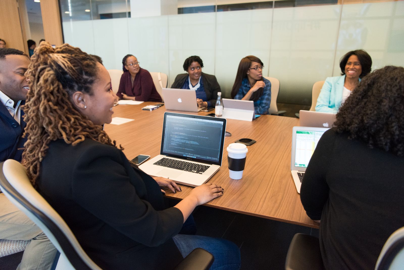 Brokerage team in discussion around a boardroom table