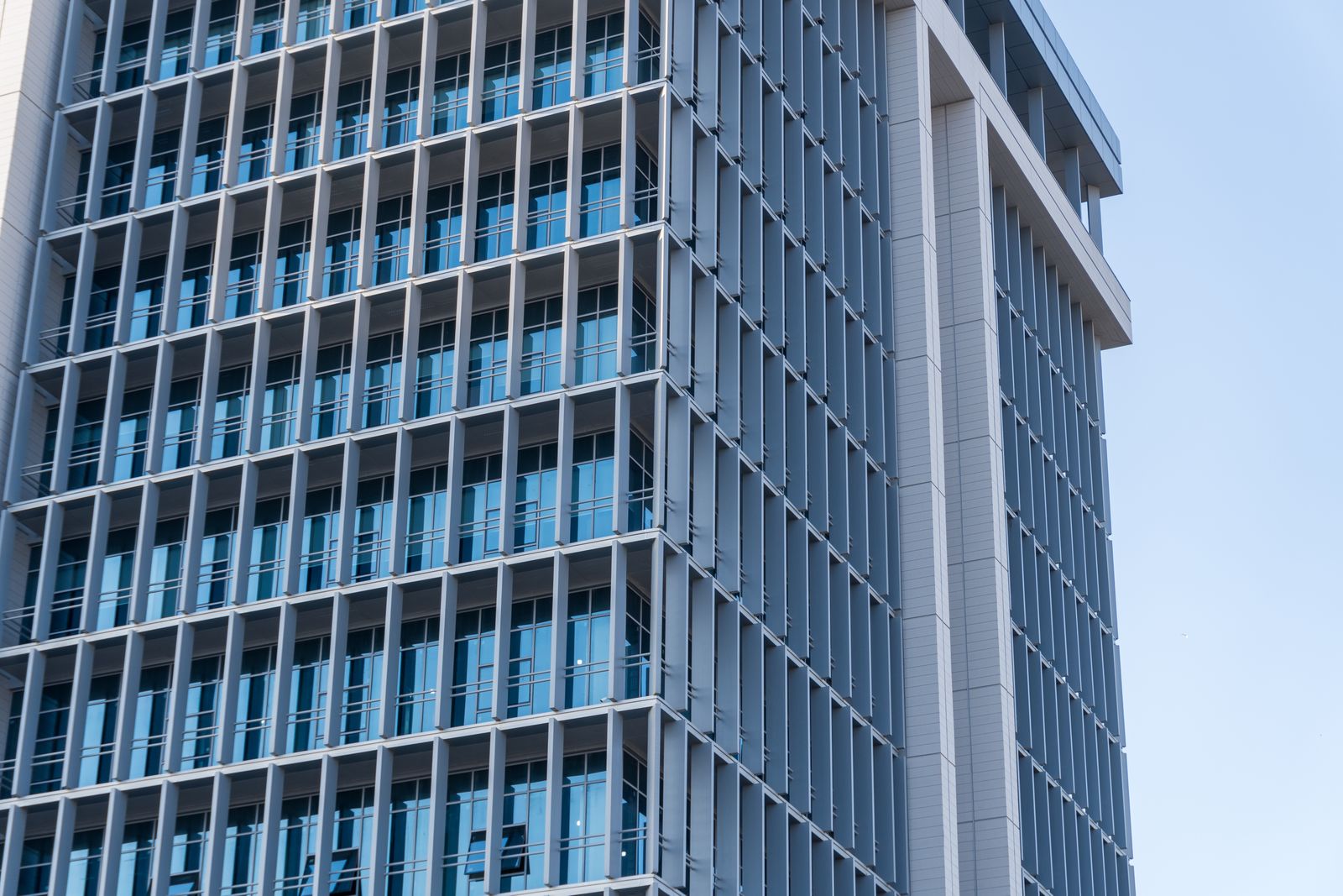 Low rise suburban office building with glass entry and landscaping